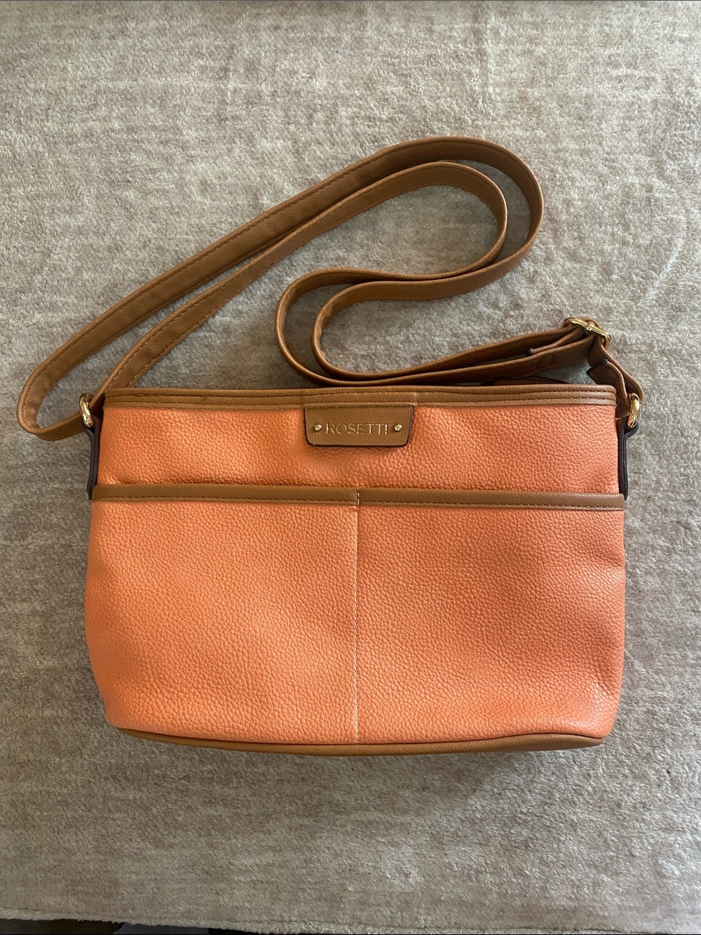 Rosetti Coral-Orange Crossbody with Tan Trim 7 Pocket’s no stains no marks.